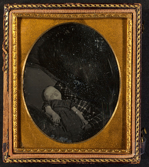 Unidentified photographer Deceased child held by excised woman, ca. 1850 Daguerreotype