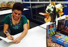 Nilofar Shidmehr signing a copy of Shirin and Salt Man