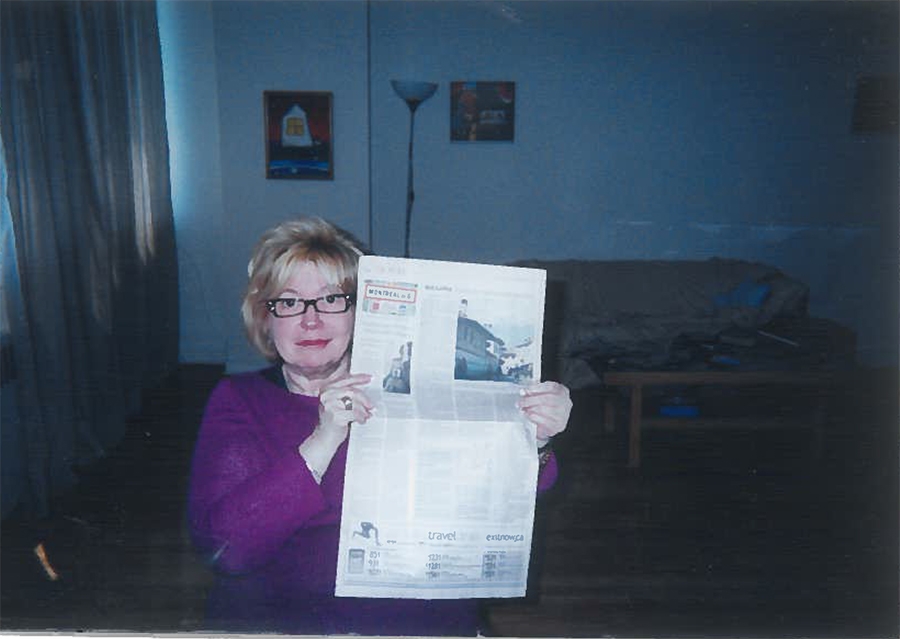 Photograph of Rebecca Papuvaru's mother holding a newspaper